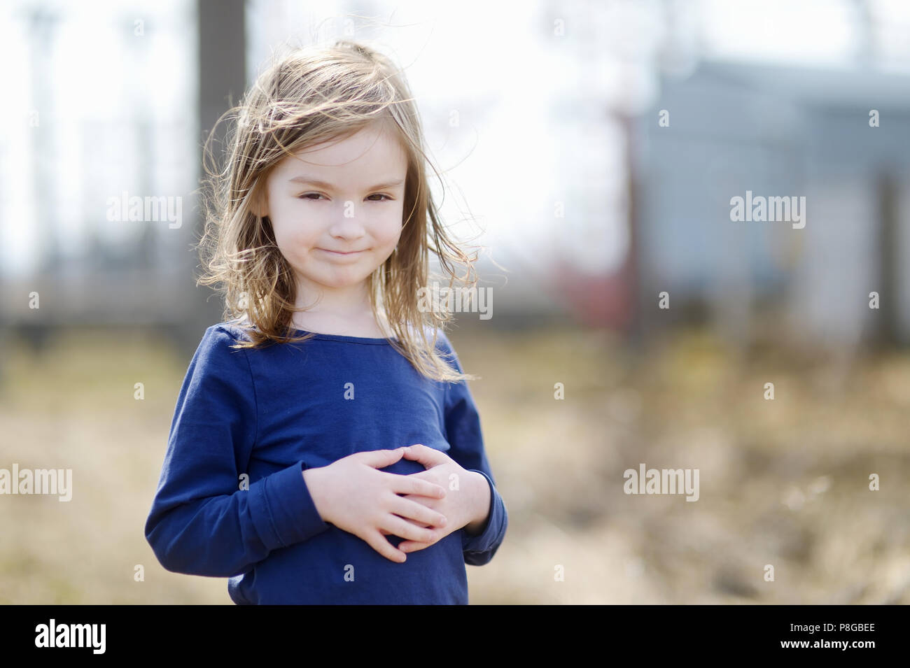 Adorable little girl portrait outdoors at summer Stock Photo - Alamy