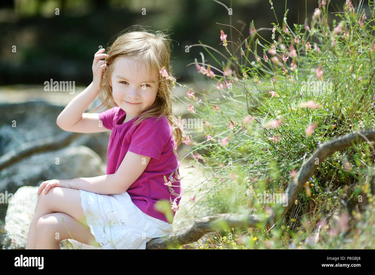 Adorable little girl portrait outdoors Stock Photo - Alamy