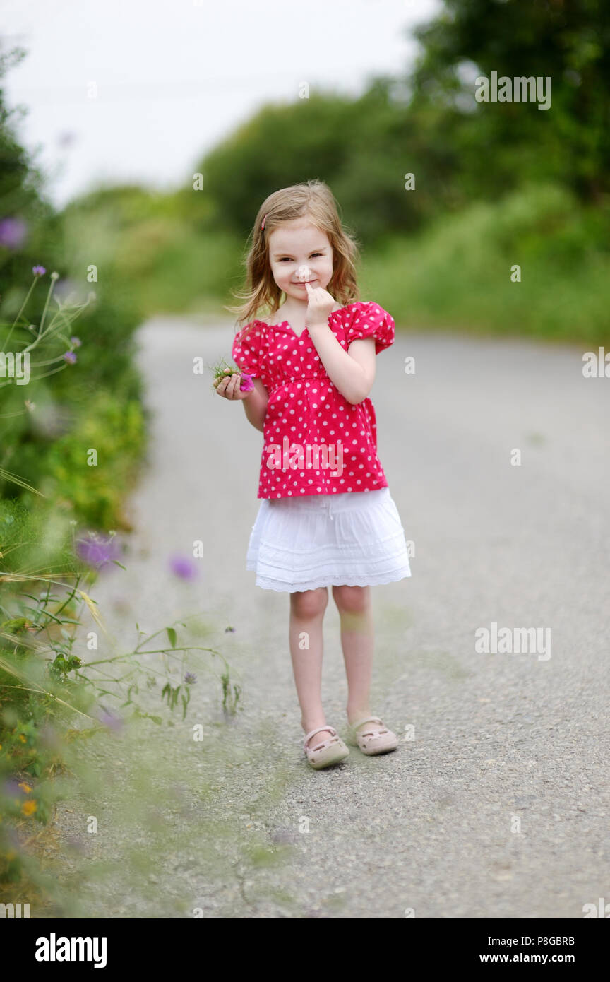 Adorable little girl portrait outdoors Stock Photo - Alamy
