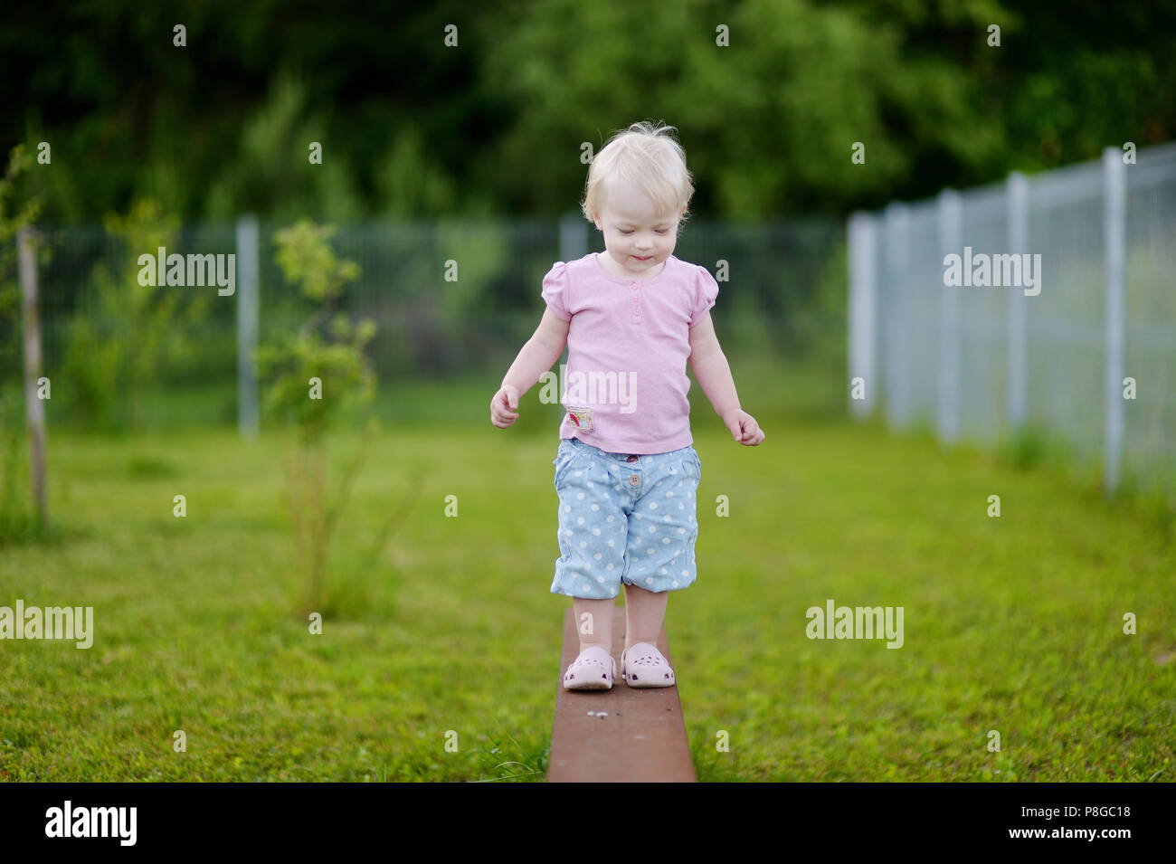 Adorable little girl portrait outdoors Stock Photo - Alamy