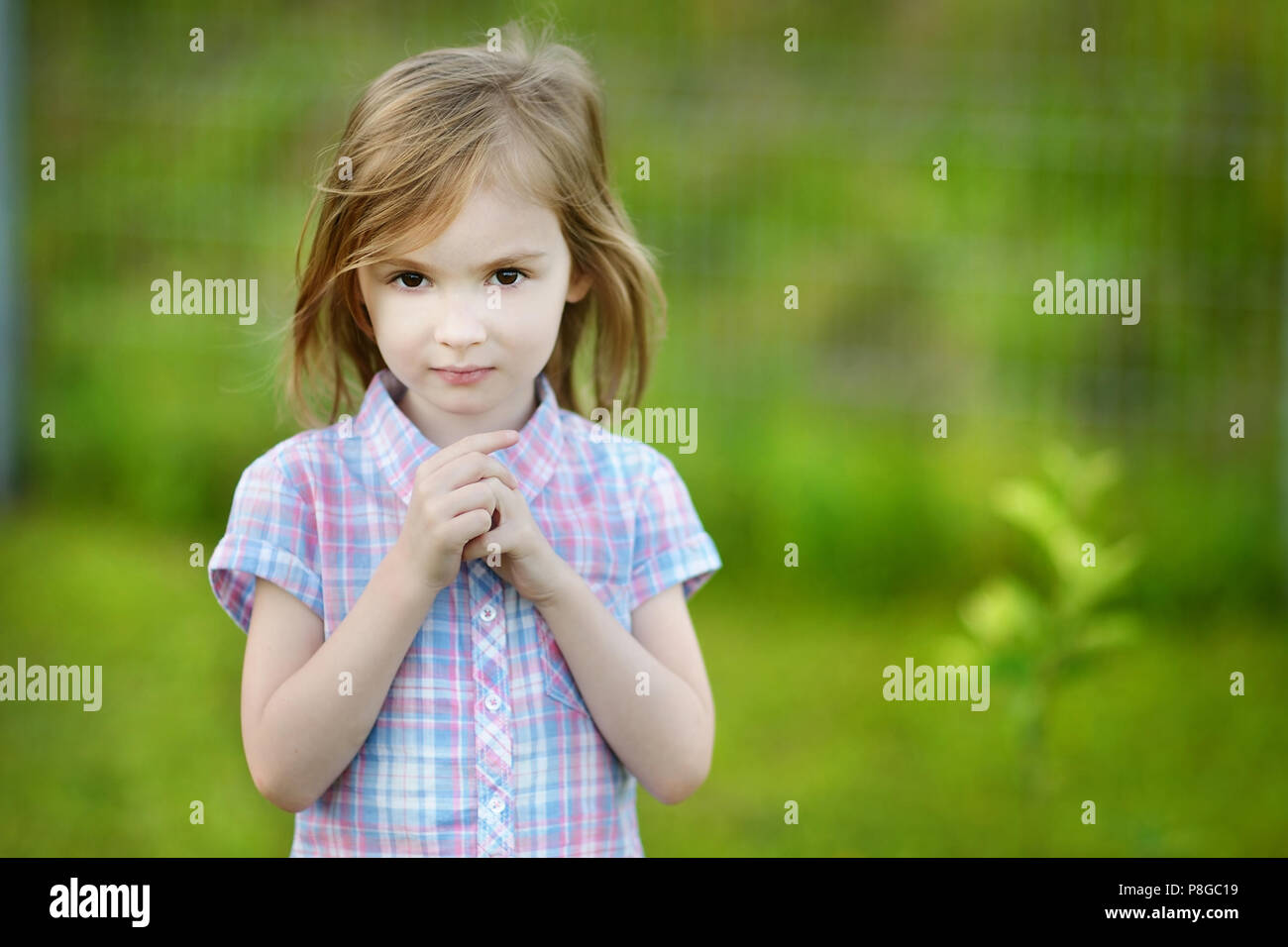 Adorable little girl portrait outdoors Stock Photo - Alamy