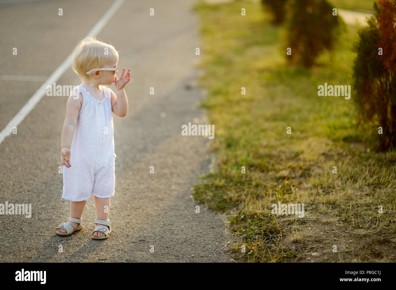 Adorable little girl portrait outdoors Stock Photo - Alamy