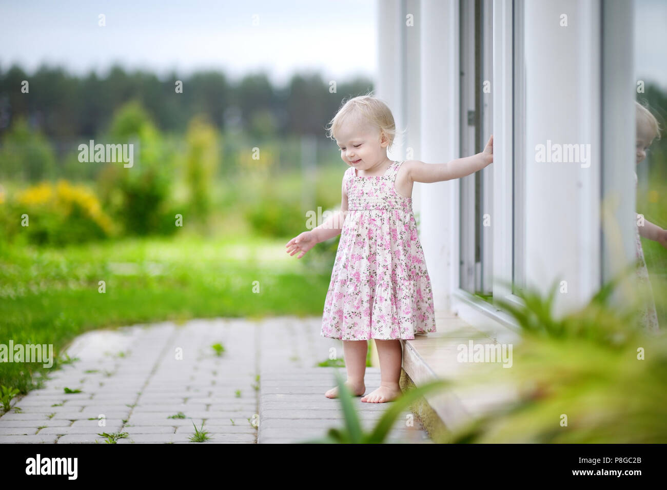 Adorable little girl portrait outdoors Stock Photo - Alamy