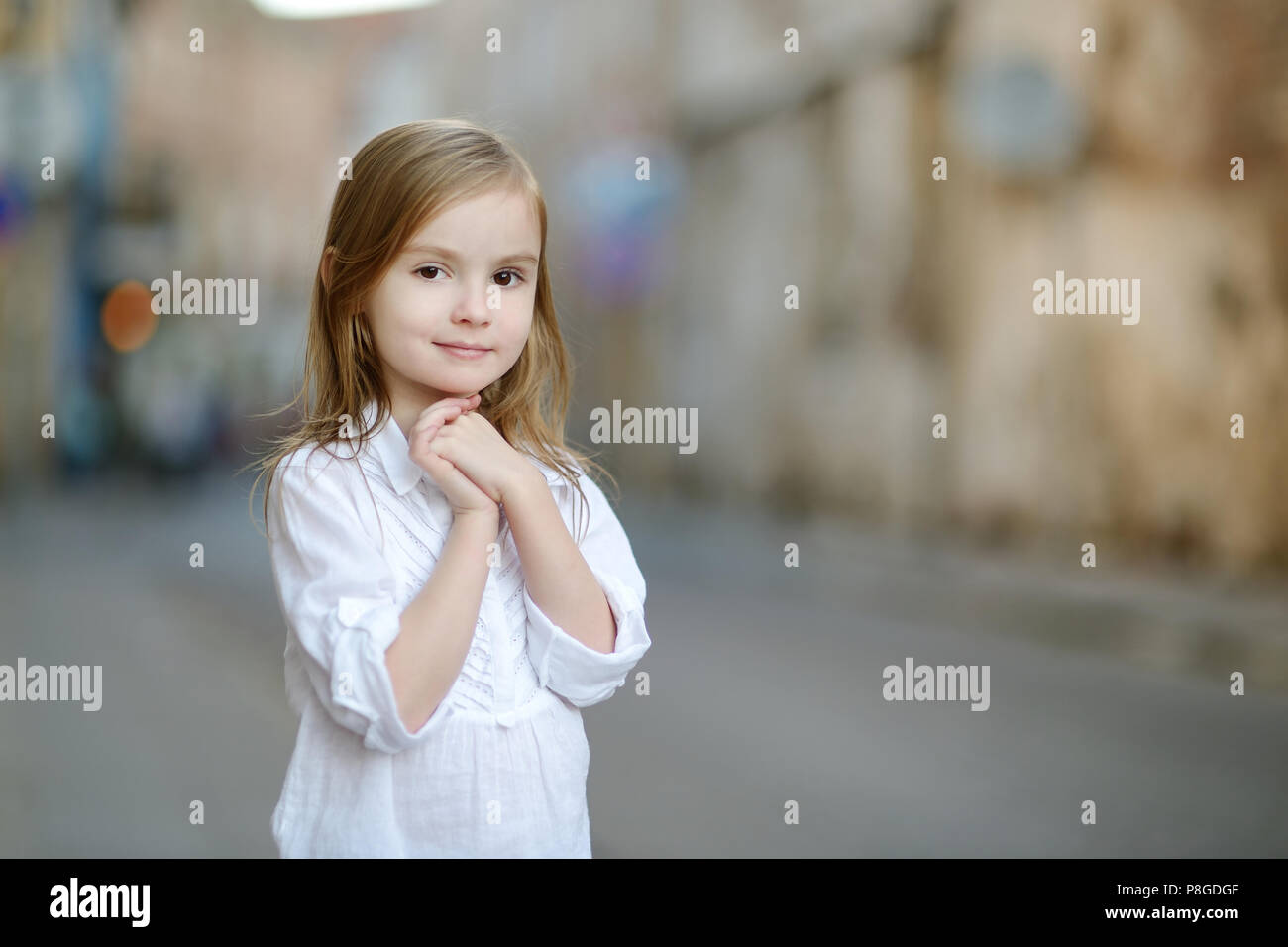 Adorable little girl portrait outdoors at summer Stock Photo - Alamy