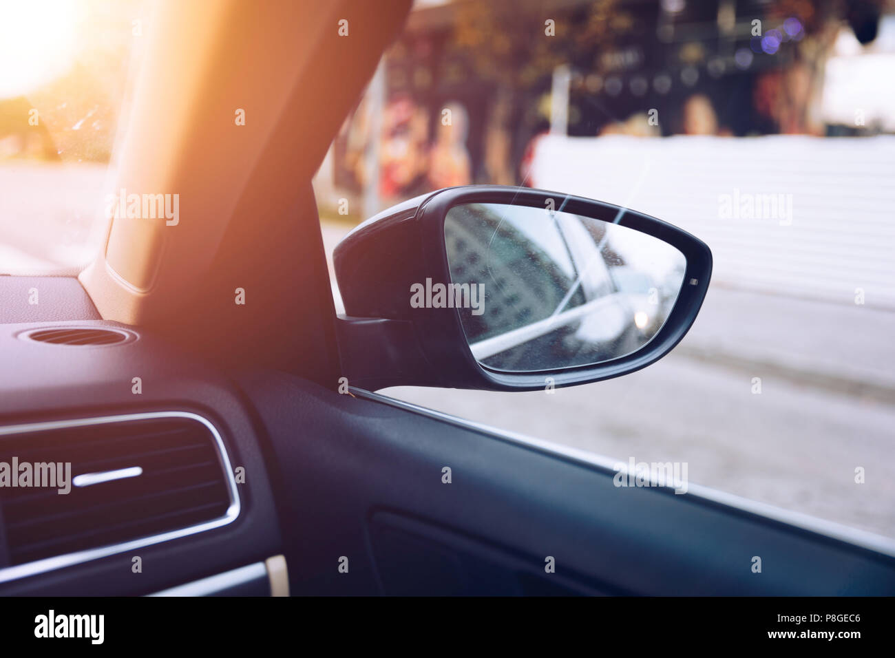 Shoot in side-view mirror of car. View from a side mirror of a car while cruising on a highway Stock Photo