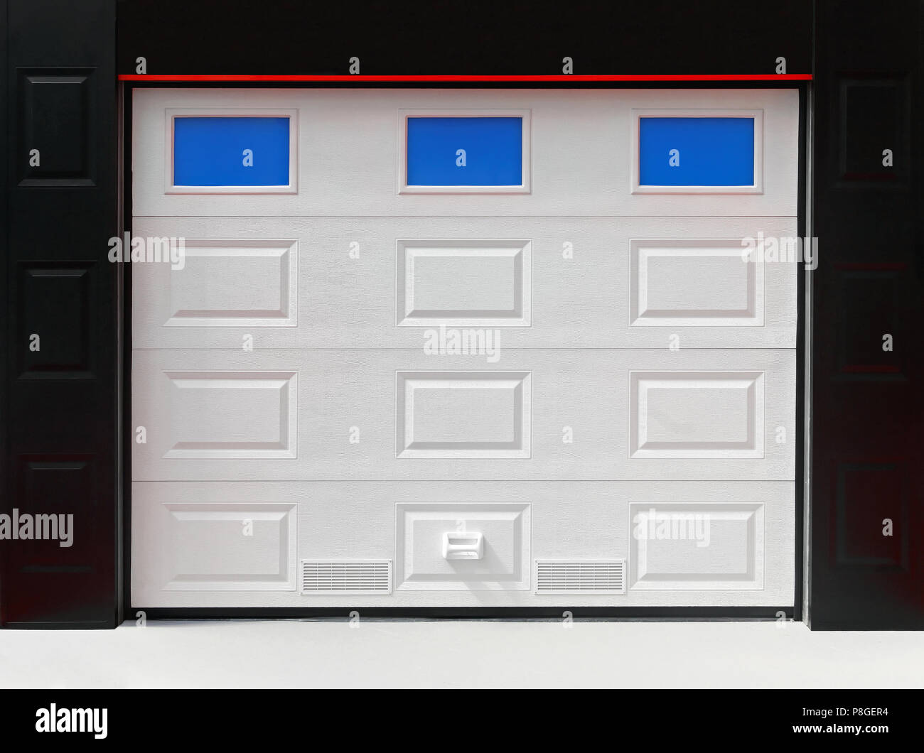 Closed white garage  door made from plastic Stock Photo