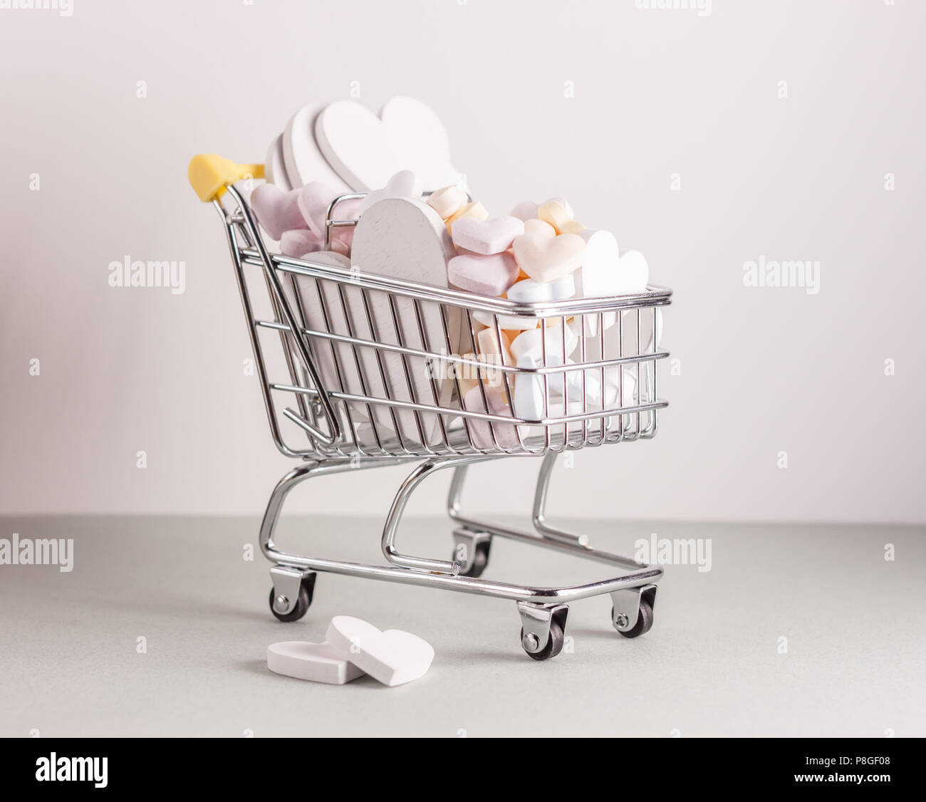 mini shopping cart with hearts Stock Photo - Alamy