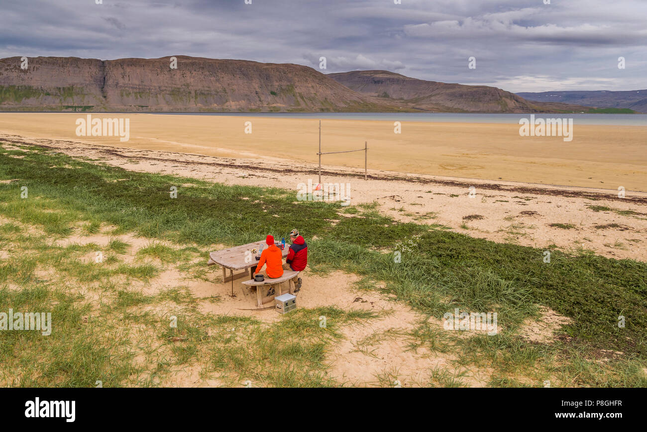 Patreksfjordur town, West Fjords, Iceland. People having a picnic by the coast, Patreksfjordur, West Fjords, Iceland Stock Photo