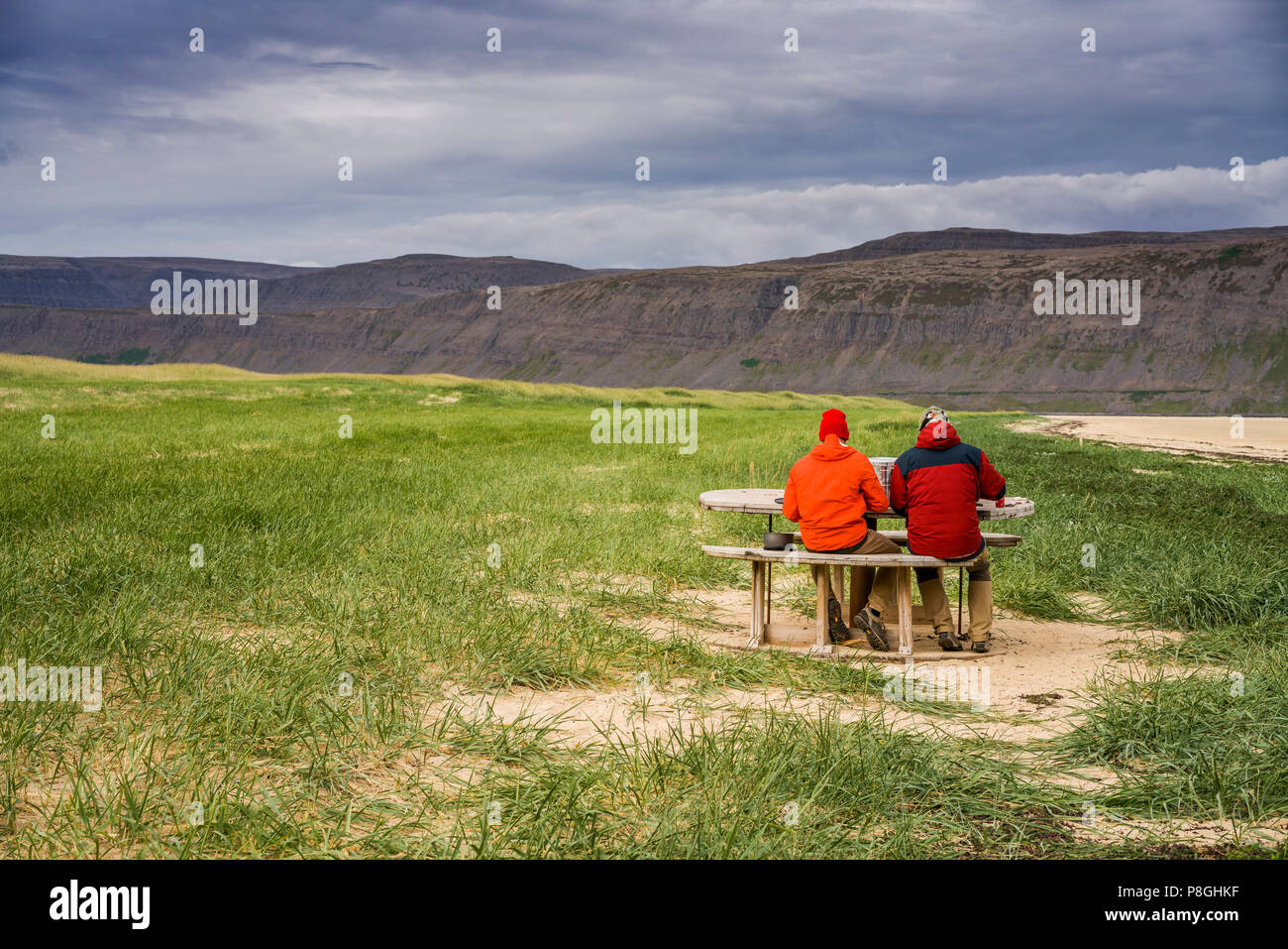 People having a picnic by the coast, Patreksfjordur, West Fjords, Iceland Stock Photo