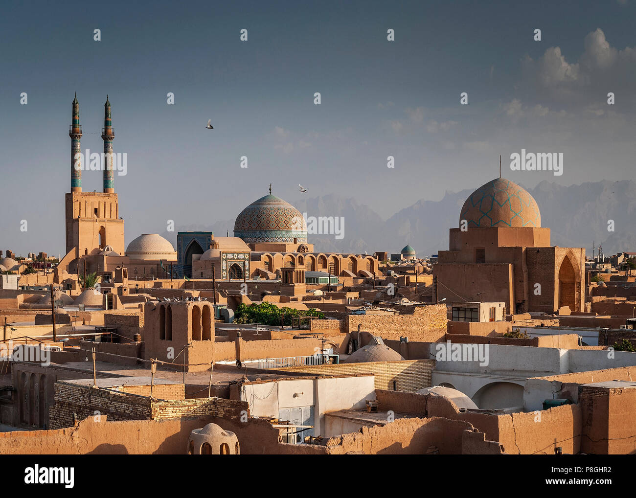 rooftops downtown mosque and landscape view of yazd city old town in iran Stock Photo