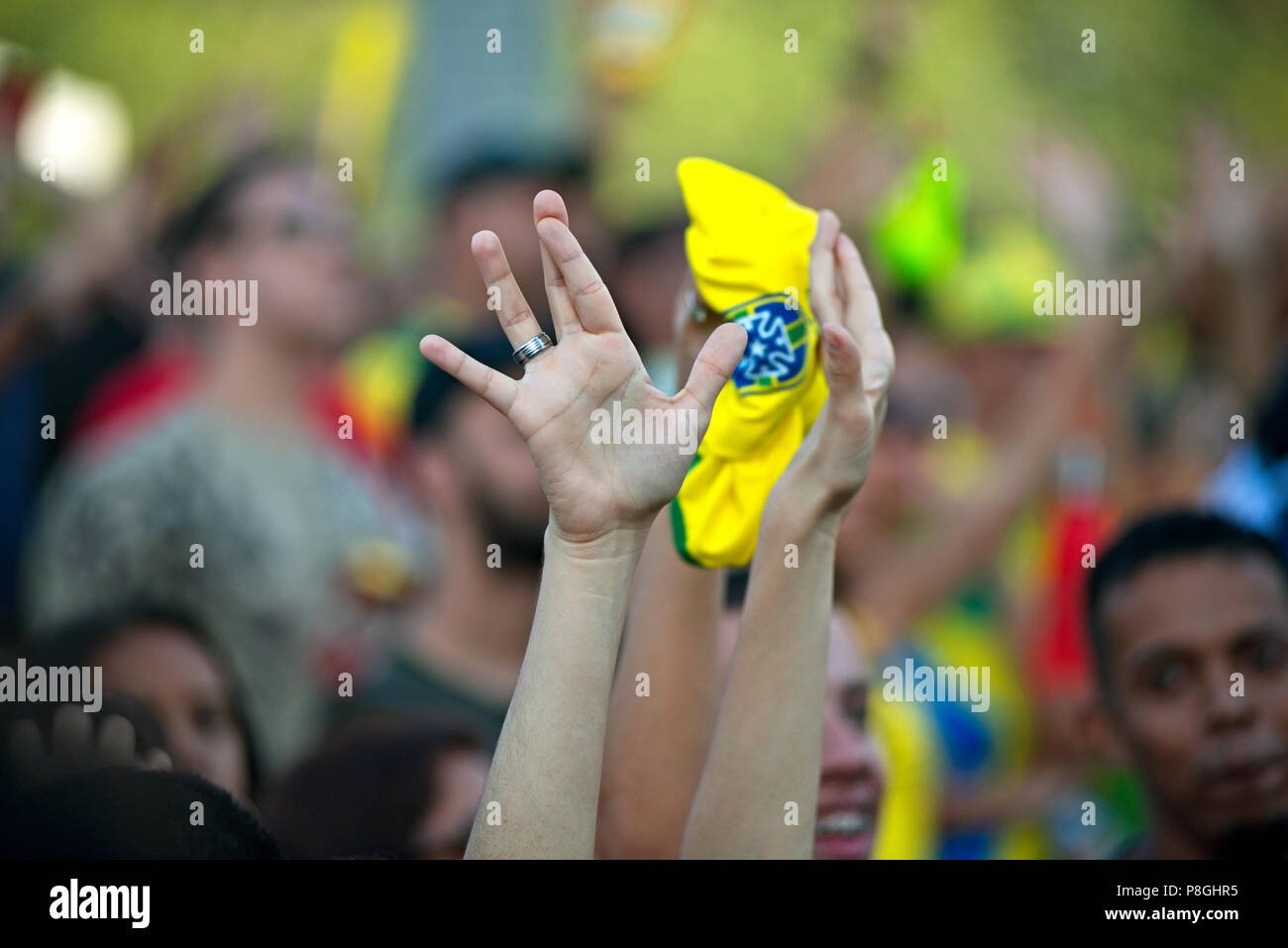 World Cup - July 6, 2018:  A Brazilian fan crosses her fingers during the match between Brazil and Belgium at a public event in Rio de Janeiro Stock Photo