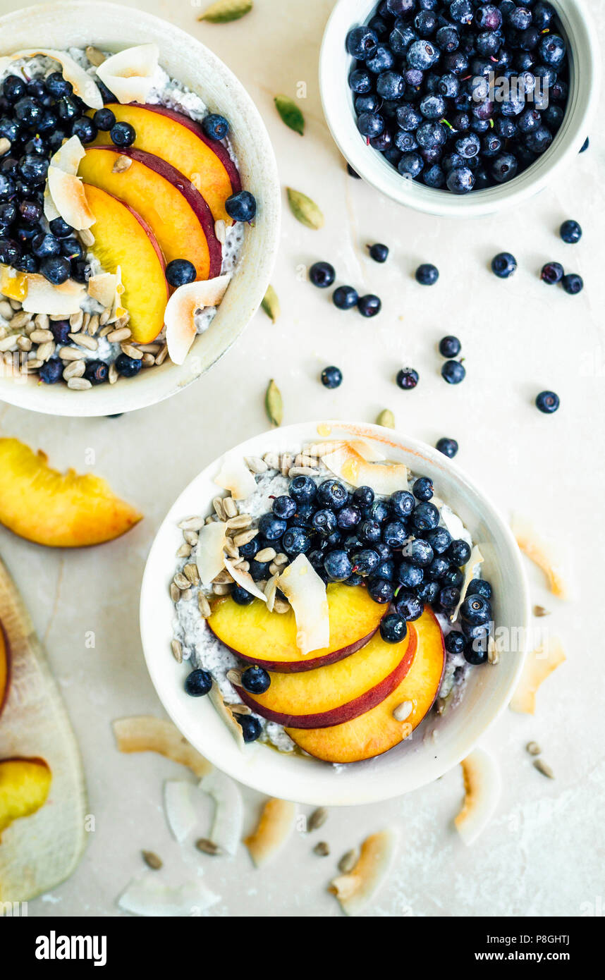 Chia pudding with nectarines, blueberries, and coconut flakes Stock