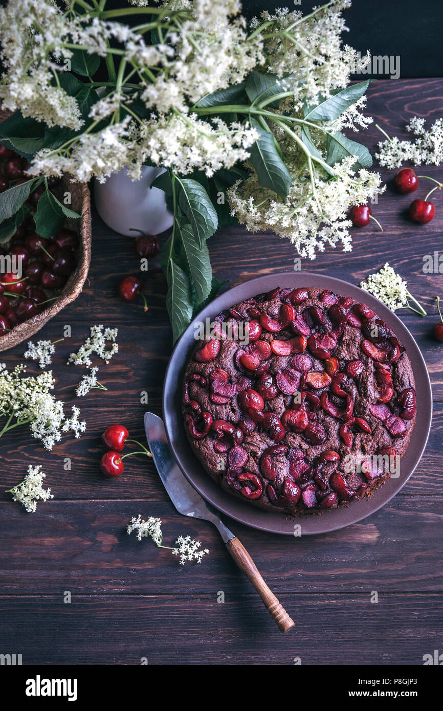 Cherry chocolate cake on a serving plate Stock Photo