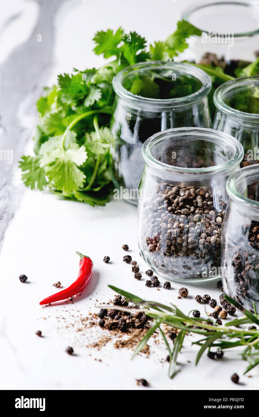 Variety of different black peppers allspice, pimento, long pepper