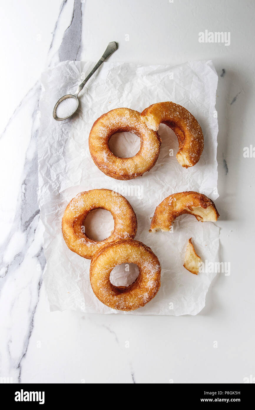 Homemade puff pastry deep fried donuts or cronuts with sugar on