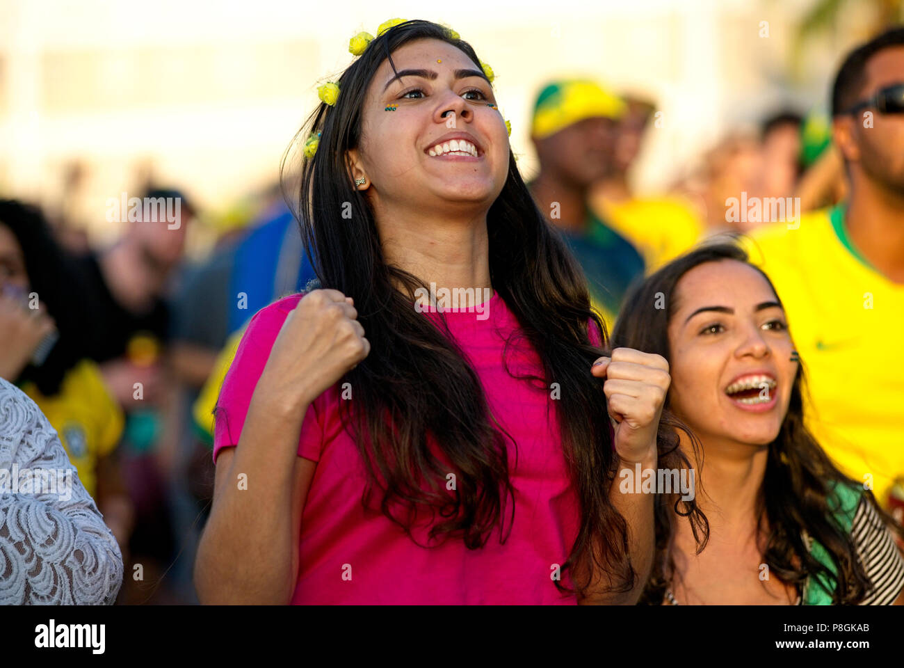 World Cup - July 6, 2018: Brazil soccer fans celebrate their team's goal against Belgium as they watch a live broadcast in Rio de Janeiro Stock Photo