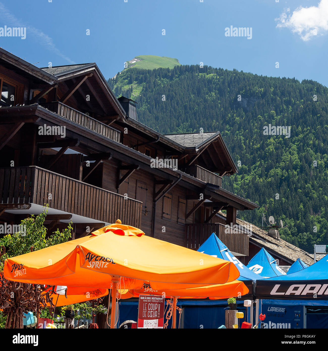 The Le Coup de Coeur Wine Bar and Restaurant and Lapierre Mountain Bike  Rental Shop in Morzine Haute-Savoie Portes du Soleil French Alps France  Stock Photo - Alamy