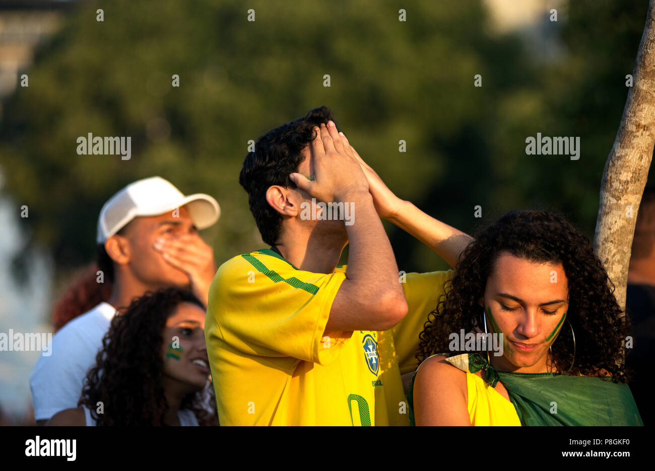 World Cup - July 6, 2018: Brazilian fans react as they watch a soccer match between Brazil and Belgium at a large screen event  in Rio de Janeiro Stock Photo