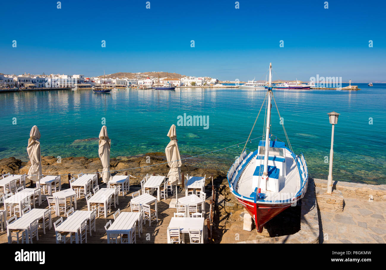 Mykonos port with boats and windmills, Cyclades islands, Greece Stock Photo