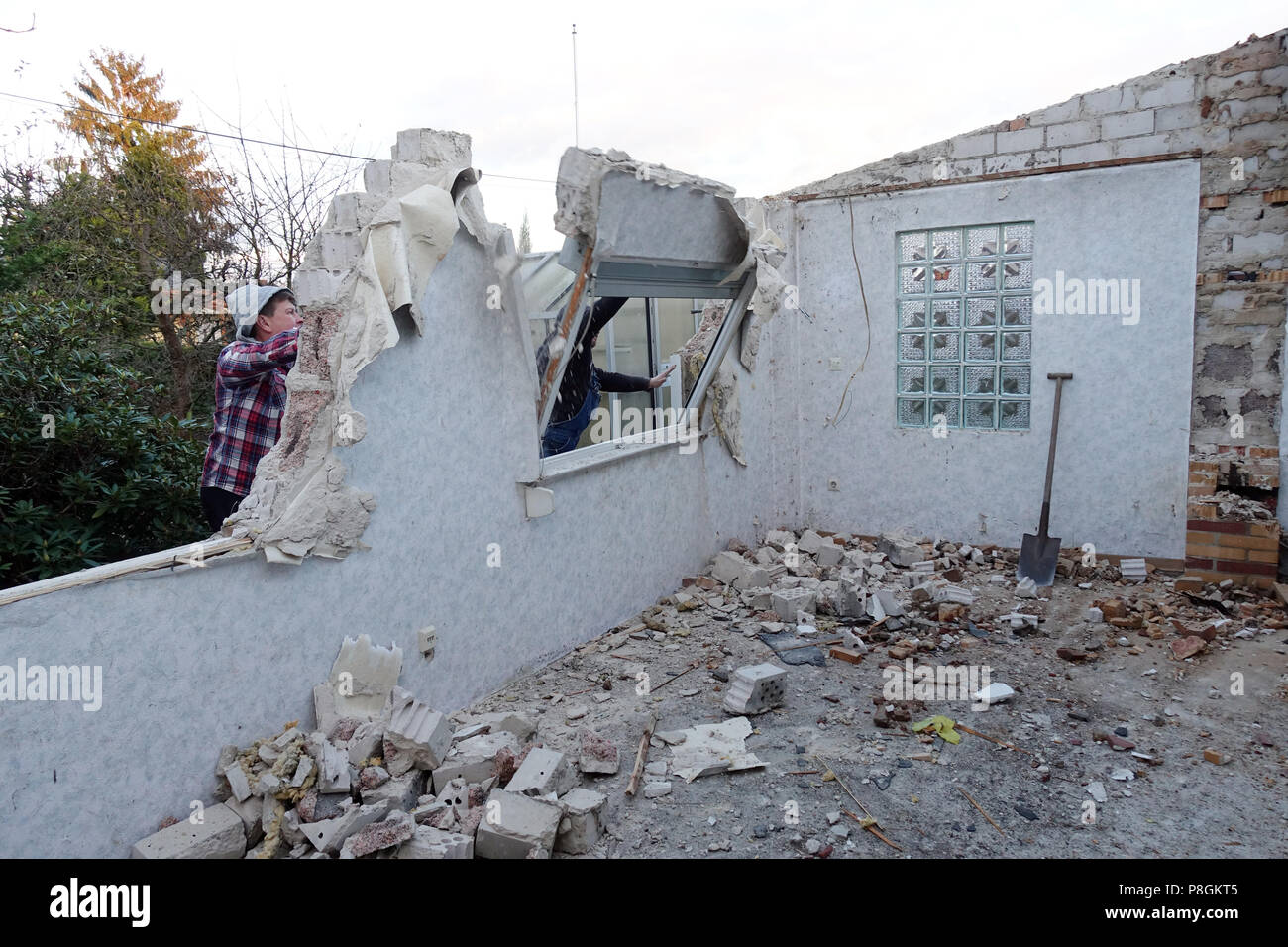 Berlin, Germany, artisans beat a wall in the rebuilding of a gazebo Stock Photo