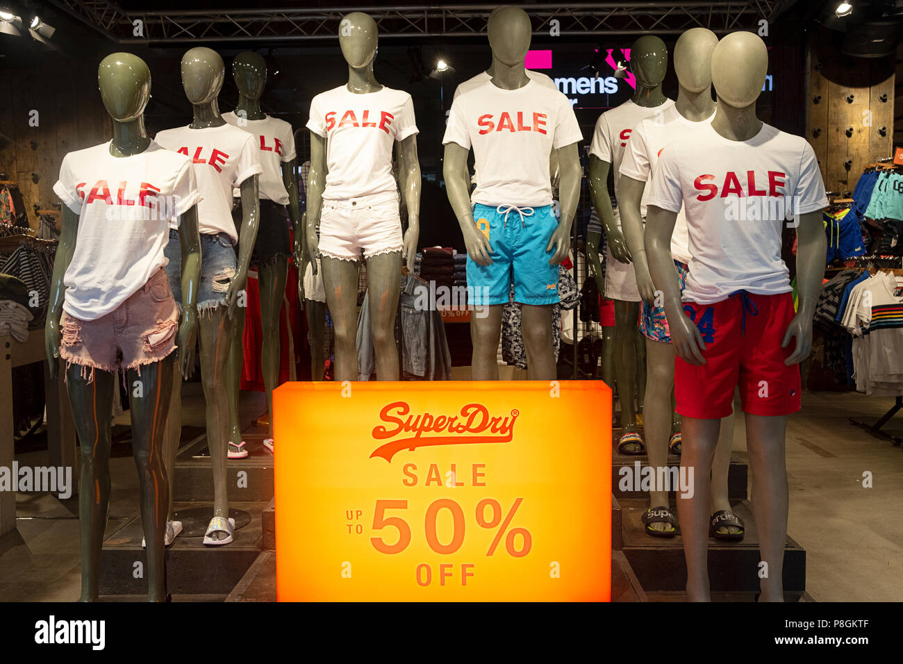 Mannequins wearing SALE tee shirts in the Super Dry store on West 34th St. in Manhattan, New York City. Stock Photo
