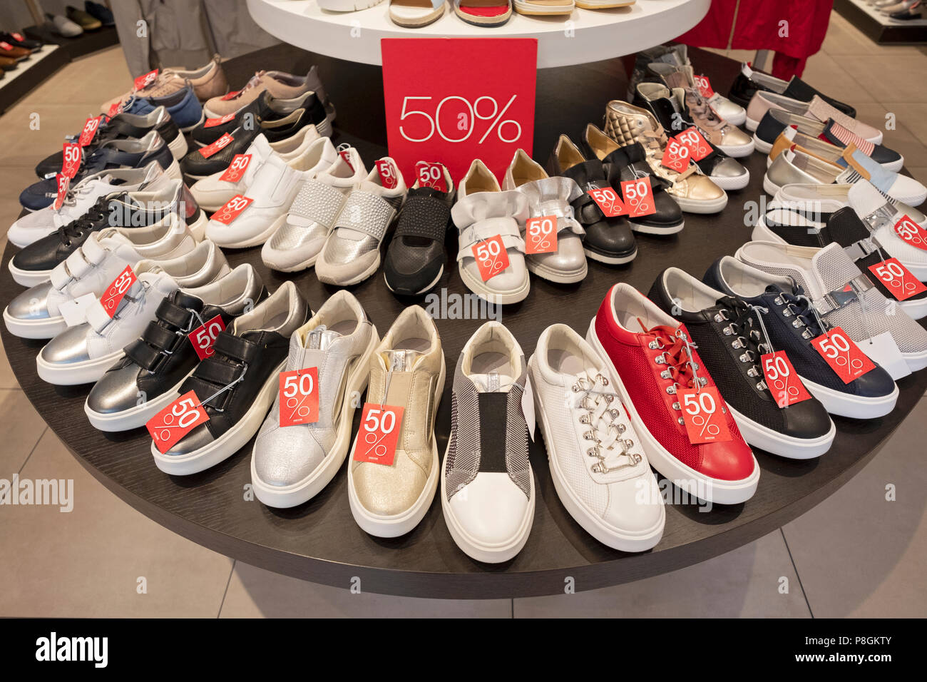 A display of shoes on sale at GEOX SHOES on West 34th Str. in the Herald  Square section of Manhattan, New York City Stock Photo - Alamy