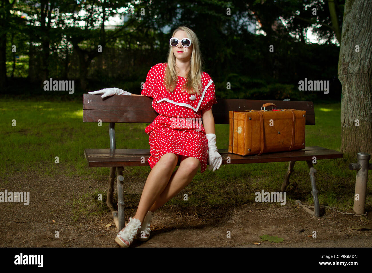 Retro vintage 60's 70's 80's young blonde girl in red dress old Stock Photo