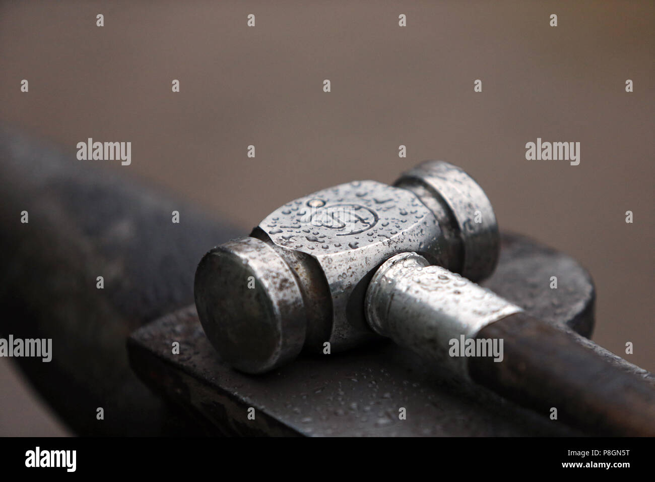 Neustadt (Dosse), hammer on an anvil Stock Photo