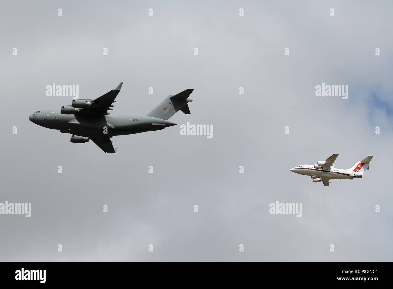 RAF Boeing C-17A Globemaster from 99 Squadron leads a BAe 146 from 32 (The Royal) Squadron over Ipswich during the 100 years RAF Anniversary flypast. Stock Photo