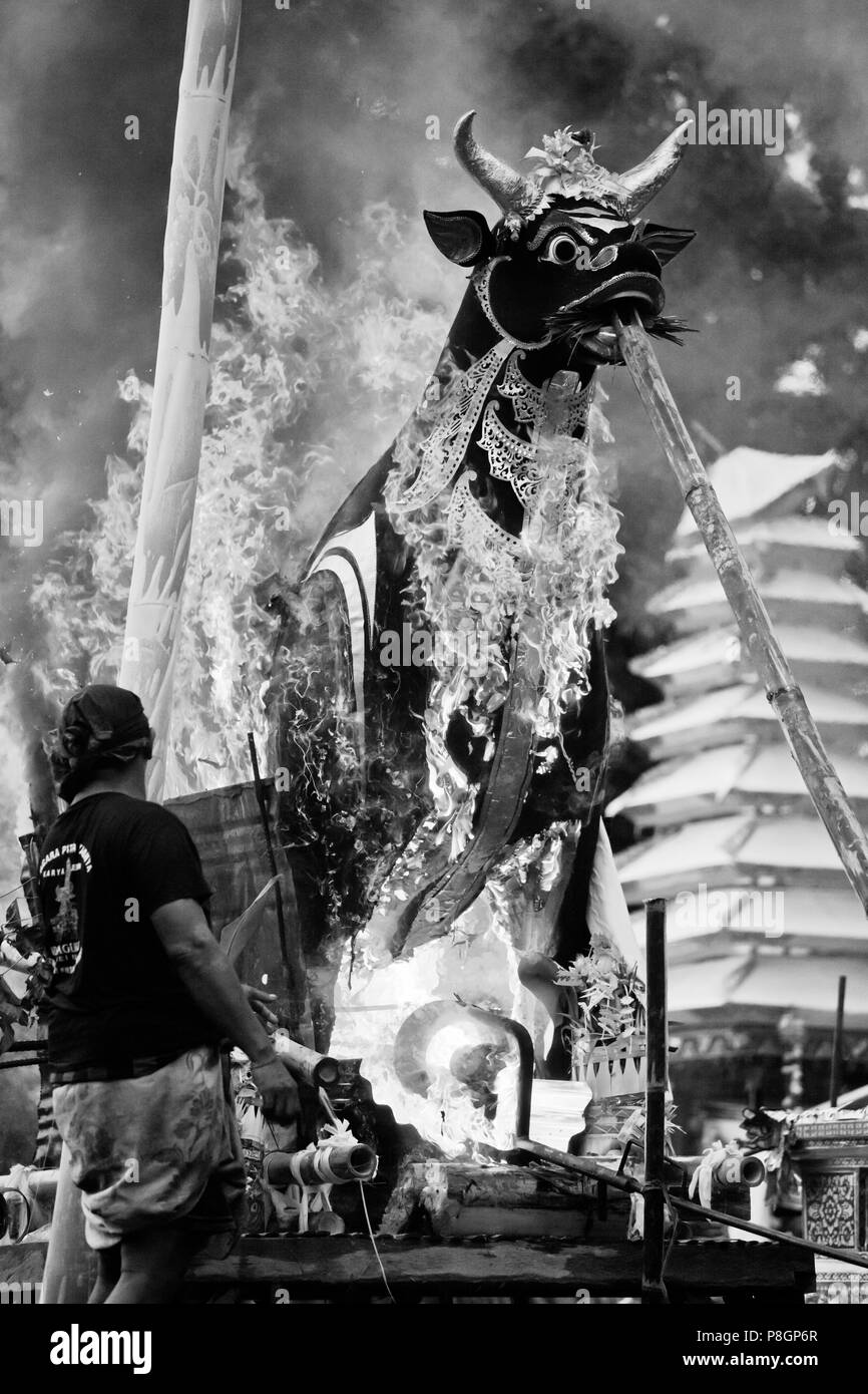 A Hindu style CREMATION where the dead body is burned inside a wooden bull - UBUD, BALI, INDONESIA Stock Photo