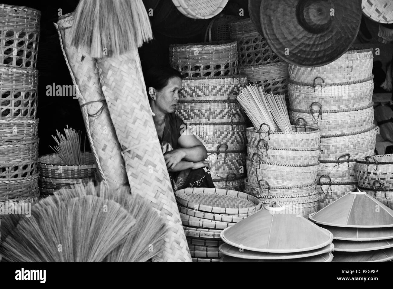 BAMBOO BROOMS, HATS and BASKETS are sold at the CENTRAL MARKET in KENGTUNG also known as  KYAINGTONG - MYANMAR Stock Photo
