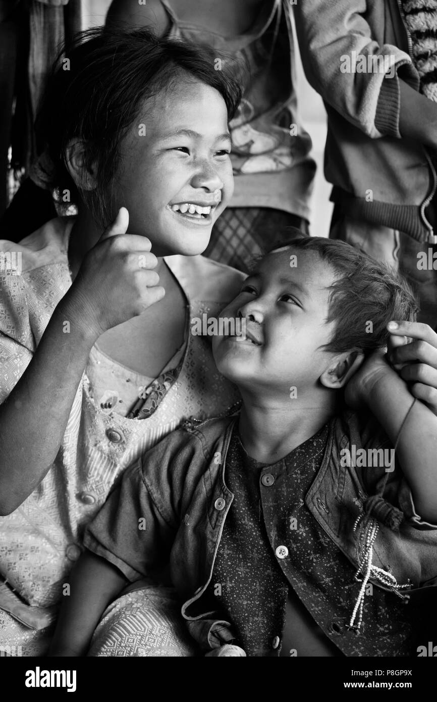 ANN TRIBAL CHILDREN laughing in a village near KENGTUNG or KYAINGTONG - MYANMAR Stock Photo