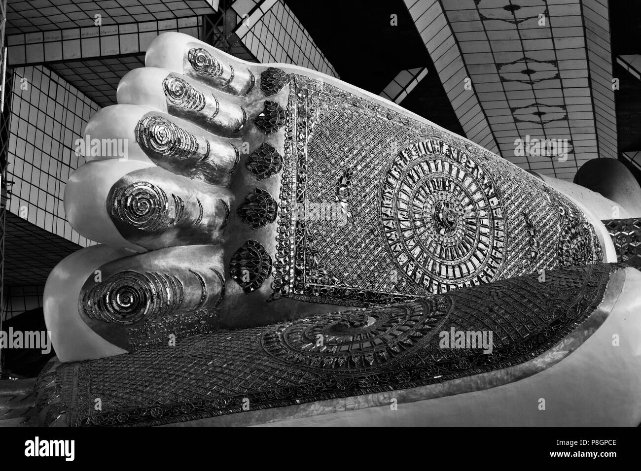 The decorated foot of the GIGANTIC SHWETHALYAUNG BUDDHA STATUE which is 55 meters long - BAGO MANMAR Stock Photo