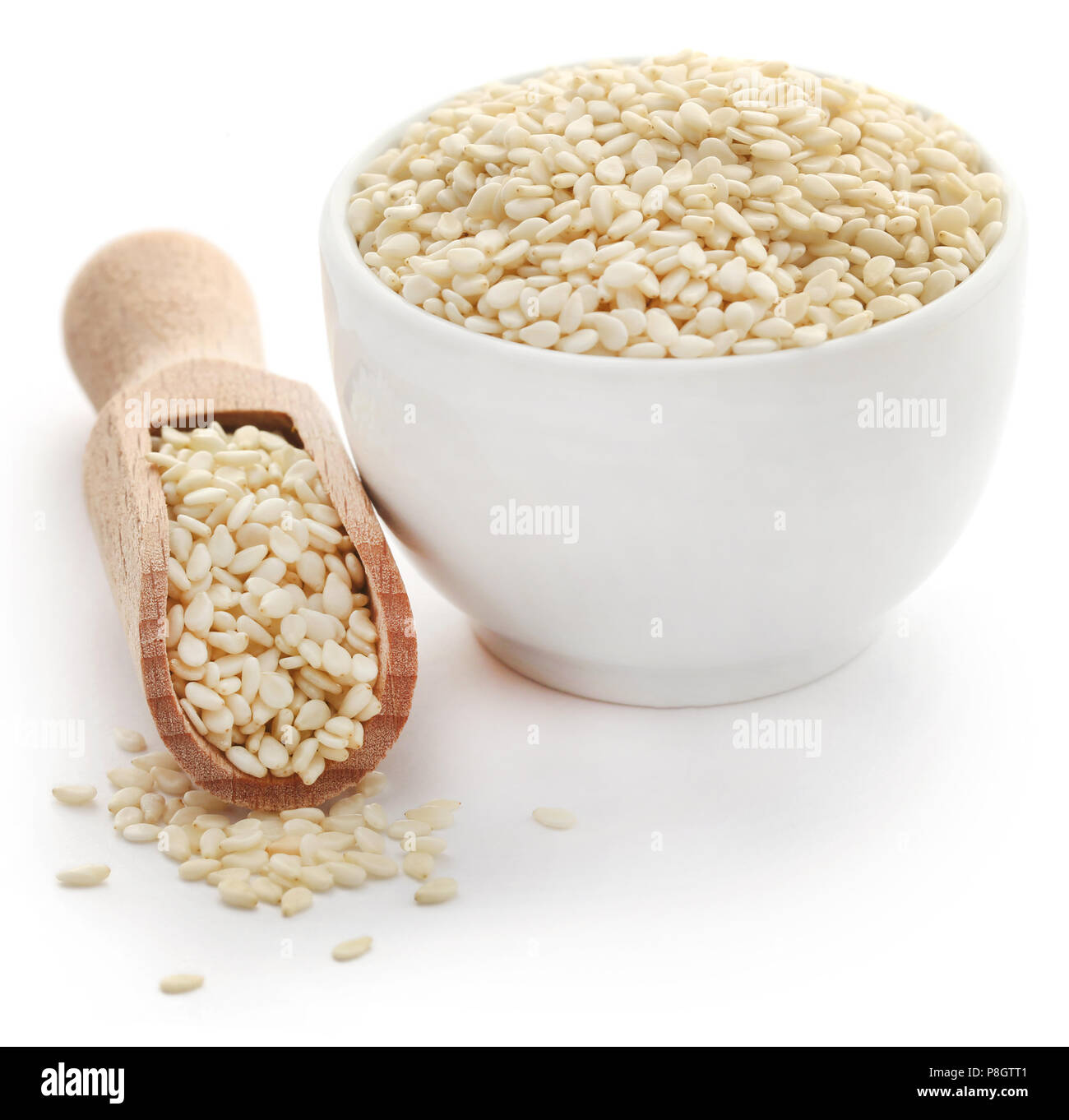 Peeled sesame seeds over white background Stock Photo Alamy