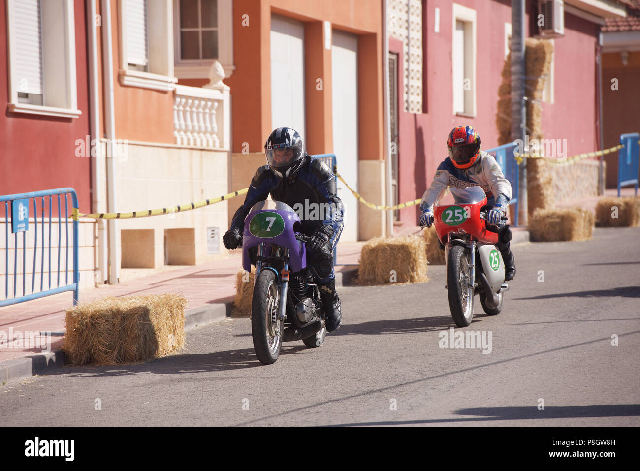Classic Motorcycle racing in the streets of Alguena, Spain Stock Photo