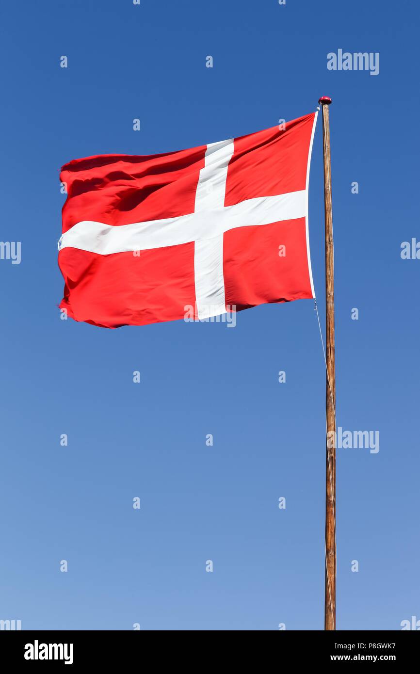 Danish flag waving in the blue sky Stock Photo