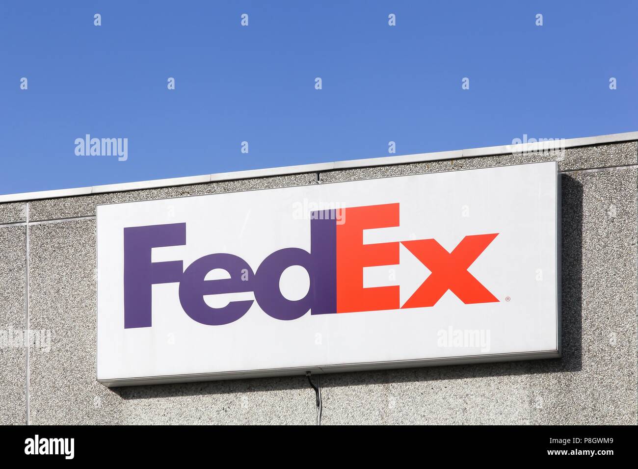 Kolding, Denmark - February 28, 2016: FedEx sign on a wall. FedEx ...