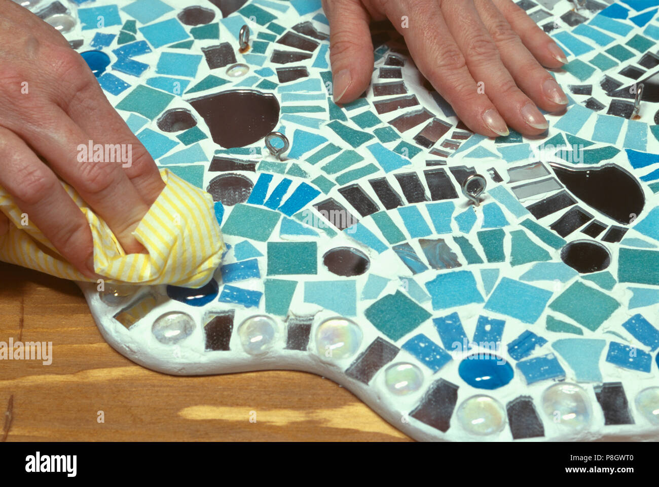 Close Up Of Hands Polishing Mosaic Work Ceiling Rose For