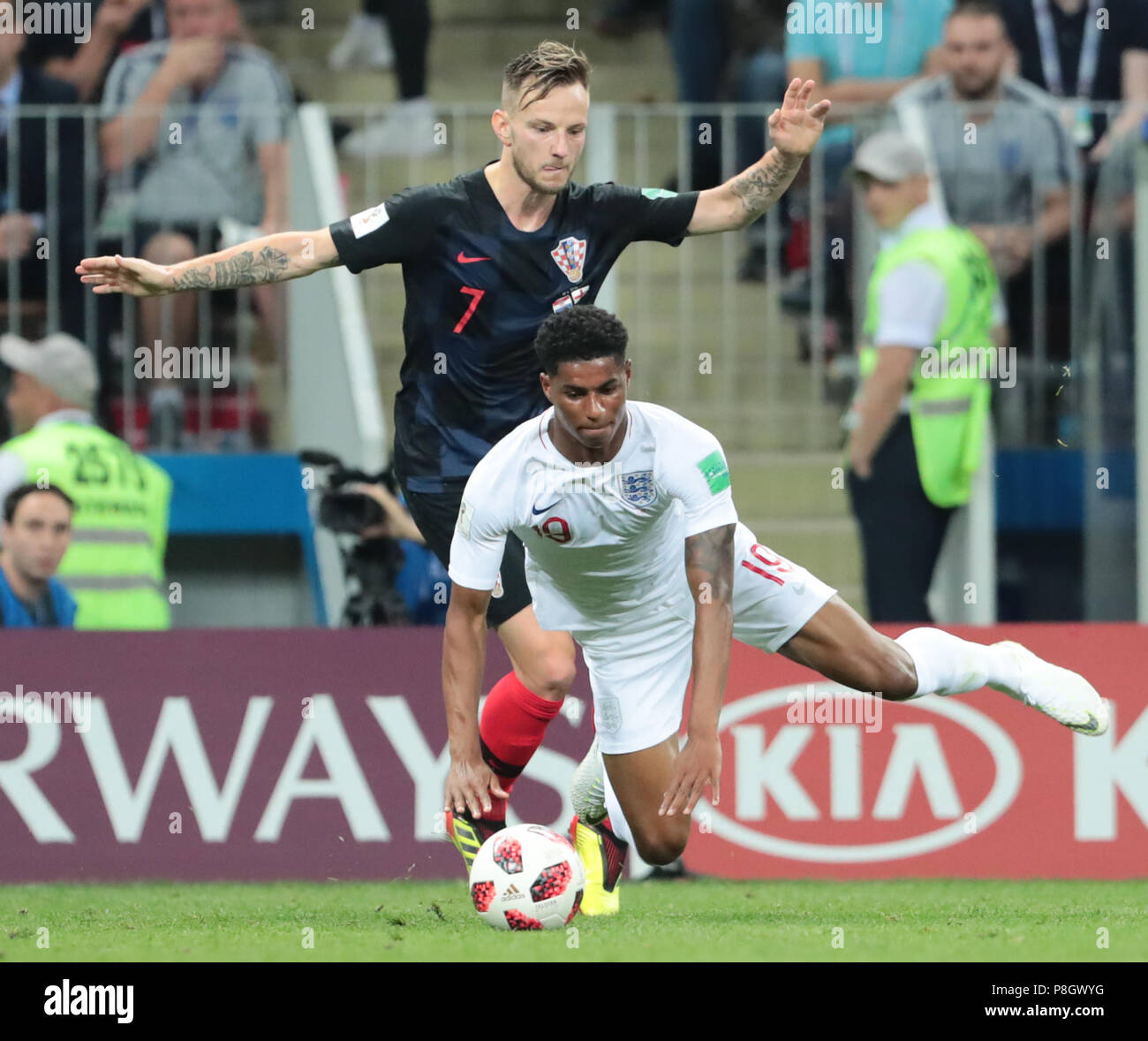 MOSCOW, RUSSIA - JULY 11: Ivan Rakitic (top) of Croatia and Marcus Rashford of England vie for the ball during the 2018 FIFA World Cup Russia Semi Final match between England and Croatia at Luzhniki Stadium on July 11, 2018 in Moscow, Russia. MB Media Stock Photo