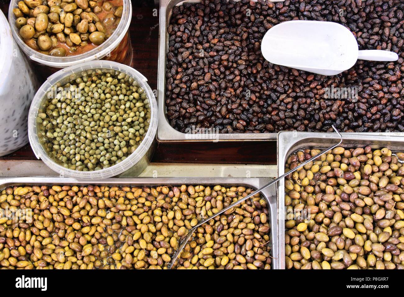 Greek cuisine various types of black and green olives at a food market Stock Photo Alamy