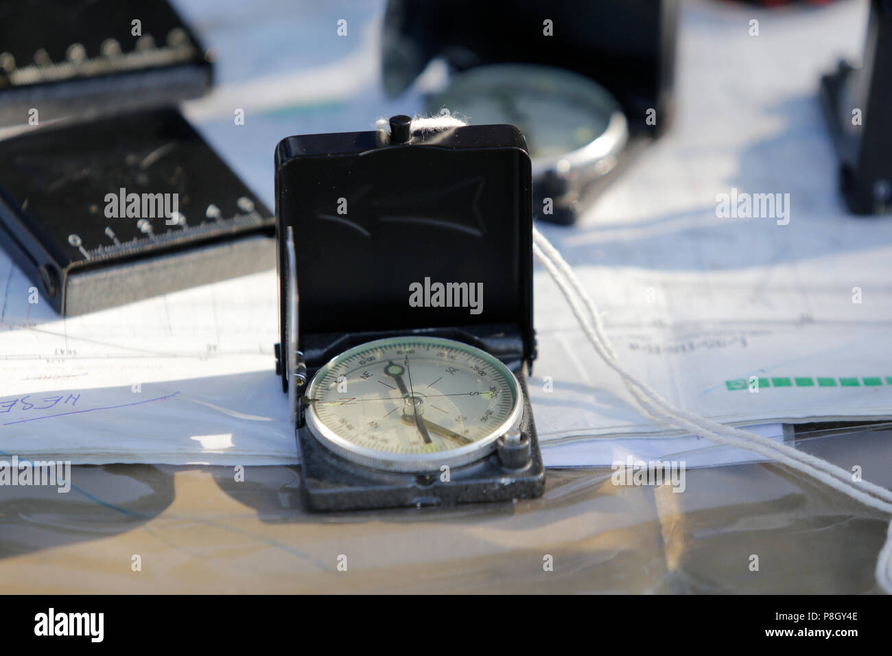 Compass and maps on the table Stock Photo