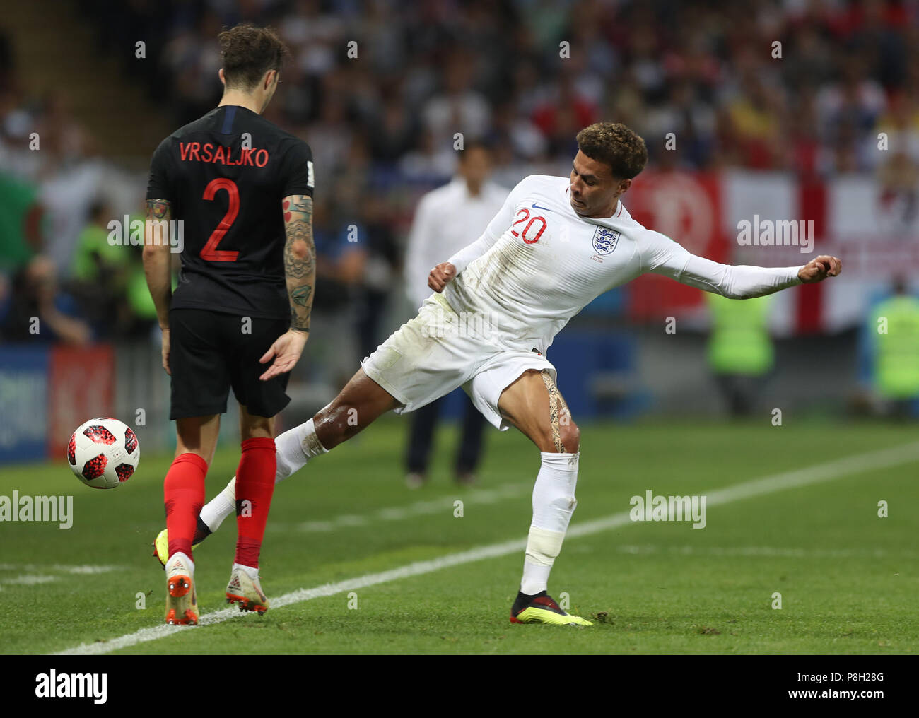 Moscow, Russia. 11th July, 2018. Dele Alli (R) of England vies with Sime Vrsaljko of Croatia during the 2018 FIFA World Cup semi-final match between England and Croatia in Moscow, Russia, July 11, 2018. Credit: Xu Zijian/Xinhua/Alamy Live News Stock Photo
