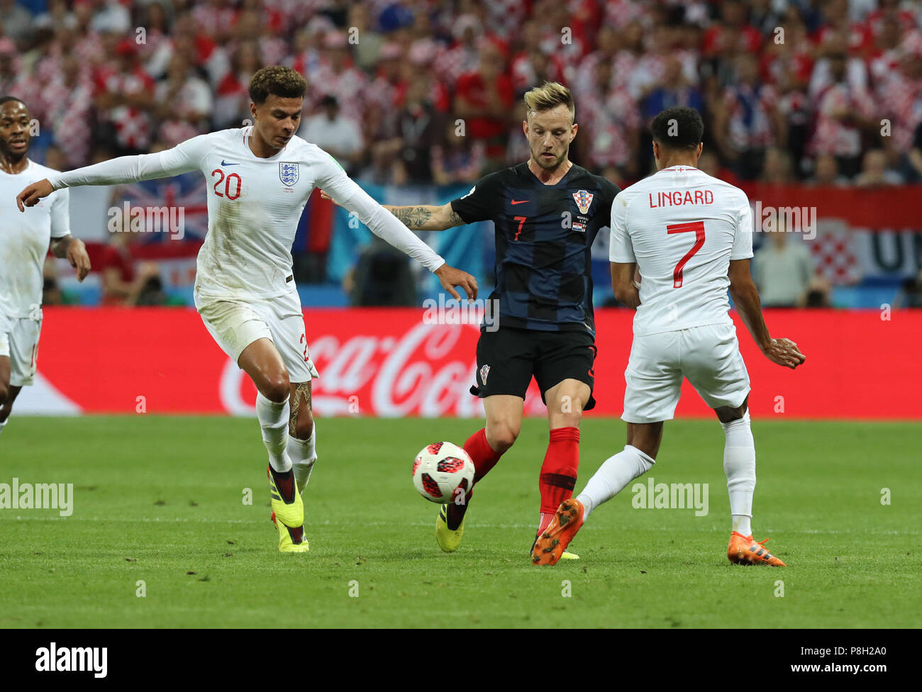 Moscow, Russia. 11th July, 2018. Ivan Rakitic (2nd R) of Croatia vies with Jesse Lingard (1st R) and Dele Alli (2nd L) of England during the 2018 FIFA World Cup semi-final match between England and Croatia in Moscow, Russia, July 11, 2018. Credit: Yang Lei/Xinhua/Alamy Live News Stock Photo