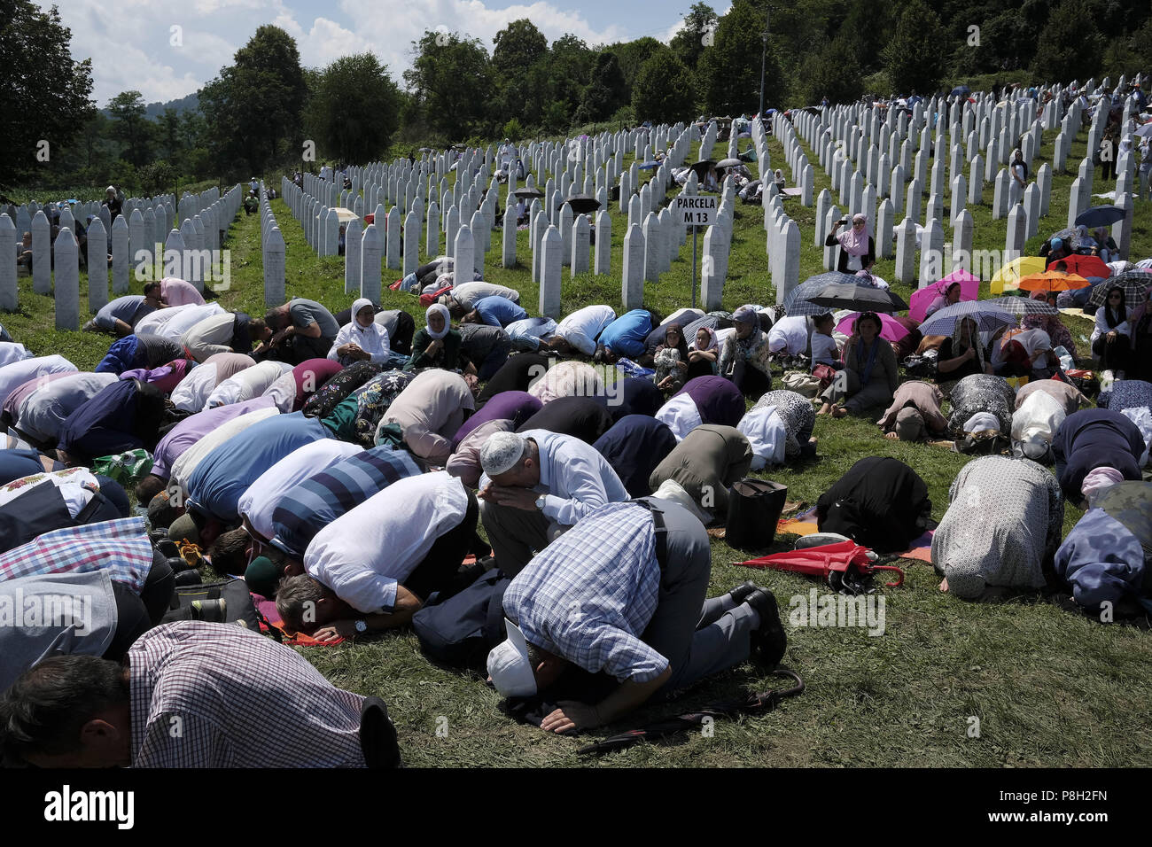 July 10, 2018 - Srebrenica, Bosnia - Twenty-three years have passed since the Srebrenica Genocide took the lives of more than 7000 victims in Bosnia and Herzegovina between 1992 and 1995. This horrific event is commemorated annually on July 10 because on that day in 1995 Bosnian Serb forces, commanded by convicted war criminal General R. Mladic, executed more than 7000 Muslim-Bosniak men, boys and elderly who had sought safety in the region after the fall of Srebrenica. Furthermore, another 25,000 people were forcibly deported in an UN-assisted ethnic cleansing that was later referred to by th Stock Photo