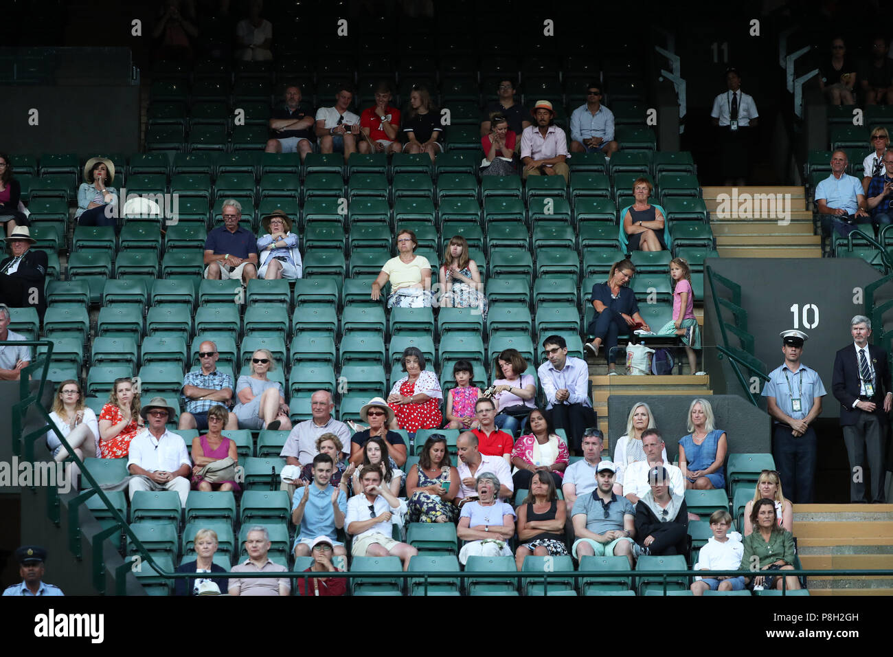 London, UK. 11th July 2018, All England Lawn Tennis and Croquet Club, London, England; The Wimbledon Tennis Championships, Day 9; Empty seats on Court number 1 between Milos Raonic (CAN) versus John Isner (USA) due to large number of tennis fans are watching England versus Croatia in the Semi Final of the Fifa World Cup Credit: Action Plus Sports Images/Alamy Live News Stock Photo