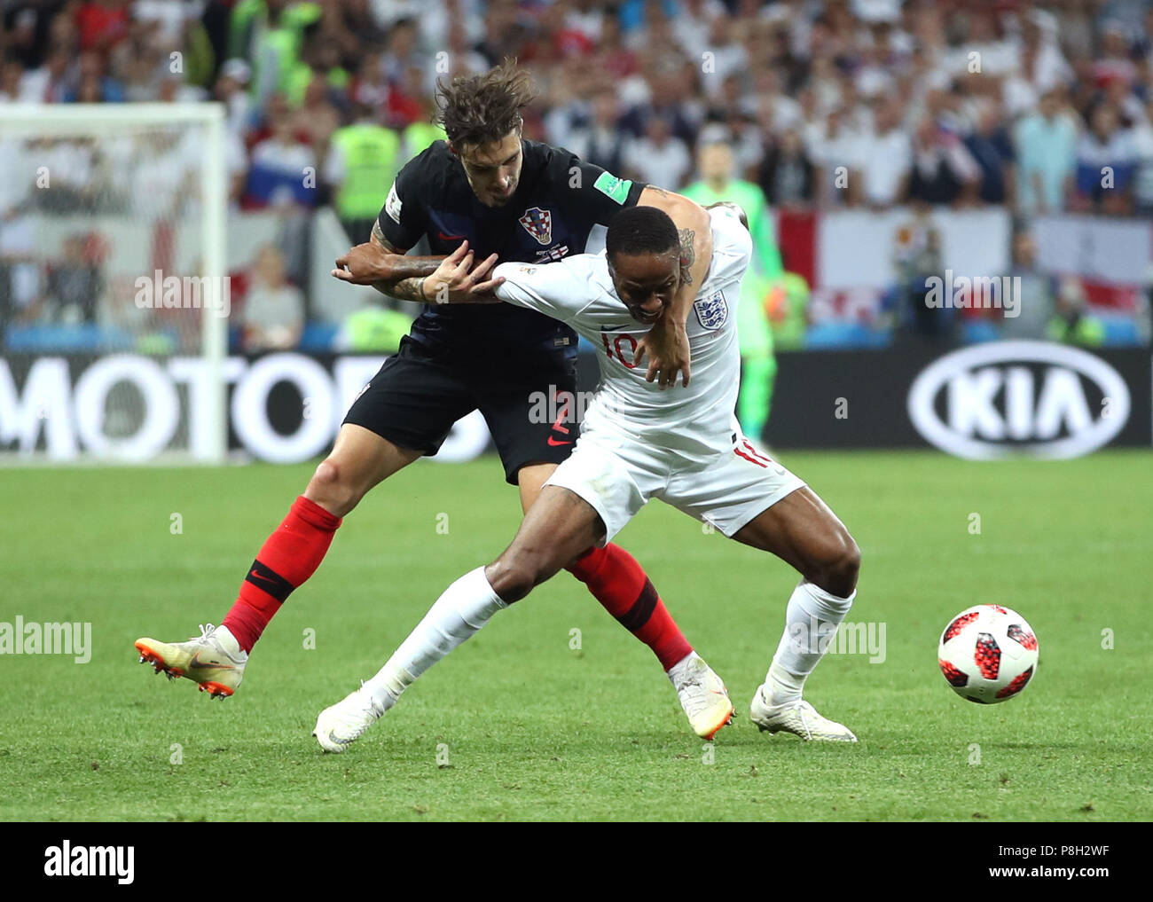 Moscow, Russia. 11th July, 2018. Raheem Sterling (R) of England vies with Sime Vrsaljko of Croatia during the 2018 FIFA World Cup semi-final match between England and Croatia in Moscow, Russia, July 11, 2018. Credit: Wu Zhuang/Xinhua/Alamy Live News Stock Photo
