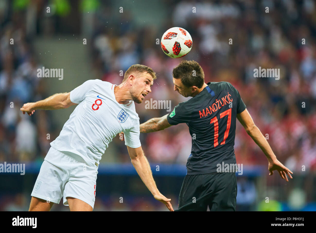 Moscow, Russia. 11th July 2018. England - Croatia, Soccer, Moscow, July 11, 2018 Mario MANDZUKIC, Croatia Nr.17  compete for the ball, tackling, duel, header against Jordan HENDERSON, England 8  ENGLAND  - CROATIA  FIFA WORLD CUP 2018 RUSSIA, Semifinal, Season 2018/2019,  July 11, 2018 in Moscow, Russia. © Peter Schatz / Alamy Live News Stock Photo