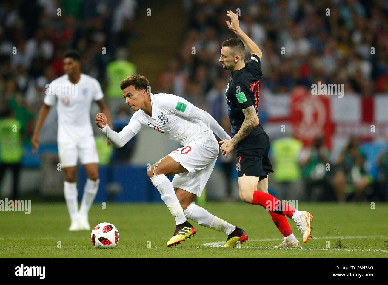 Moscow, Russia. 11th July 2018. Dele Alli of England under pressure from Marcelo Brozovic of Croatia during the 2018 FIFA World Cup Semi Final match between Croatia and England at Luzhniki Stadium on July 11th 2018 in Moscow, Russia. (Photo by Daniel Chesterton/phcimages.com) Credit: PHC Images/Alamy Live News Stock Photo
