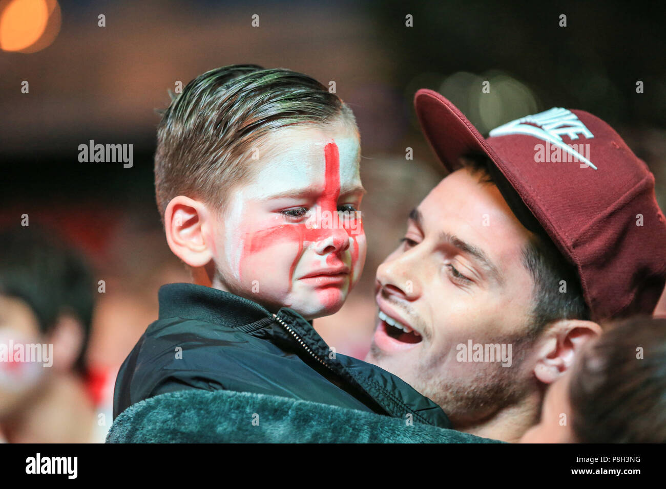 Millennium Square, Leeds, UK. 11th July 2018 , Millennium Square, Leeds, England; Fifa World Cup Semi-Final Croatia v England live big screen viewing in Millennium Square Leeds; a young fan is in tears as England go out Credit: News Images /Alamy Live News Stock Photo