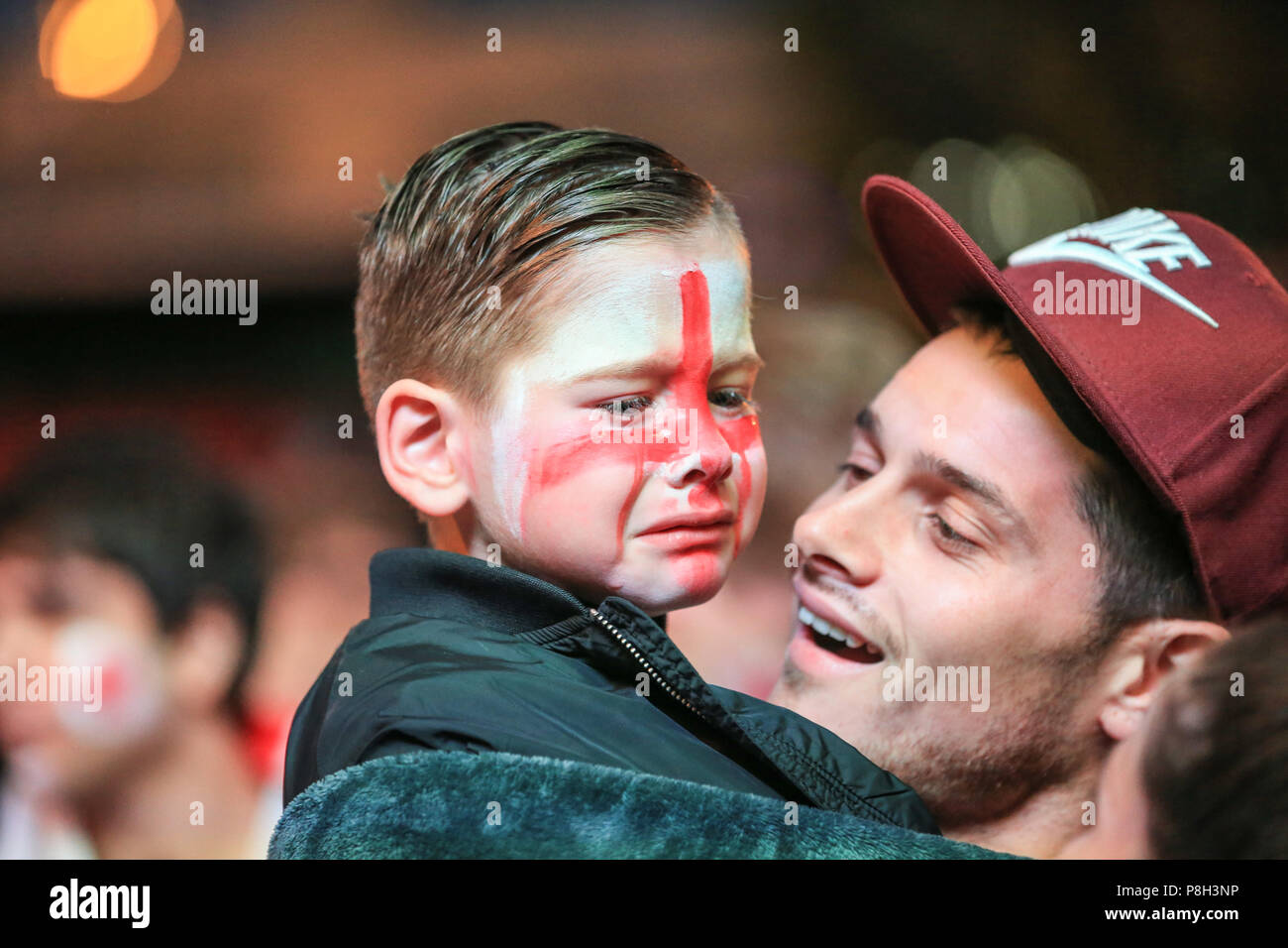 Millennium Square, Leeds, UK. 11th July 2018 , Millennium Square, Leeds, England; Fifa World Cup Semi-Final Croatia v England live big screen viewing in Millennium Square Leeds; a young fan is in tears as England go out Credit: News Images /Alamy Live News Stock Photo
